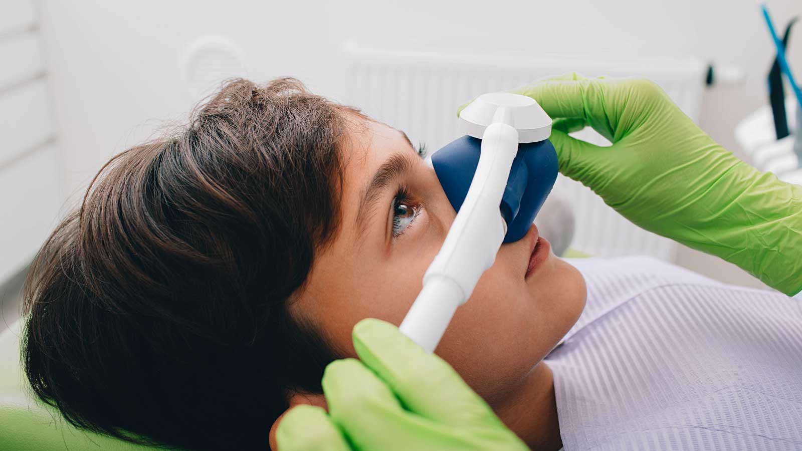 Child-receiving-nitrous-oxide-sedation-at-the-dentist