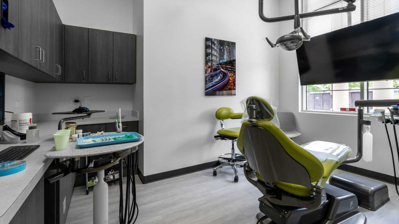 A modern dental treatment room equipped with advanced technology