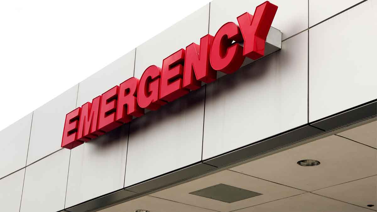 Red emergency sign on a hospital building exterior