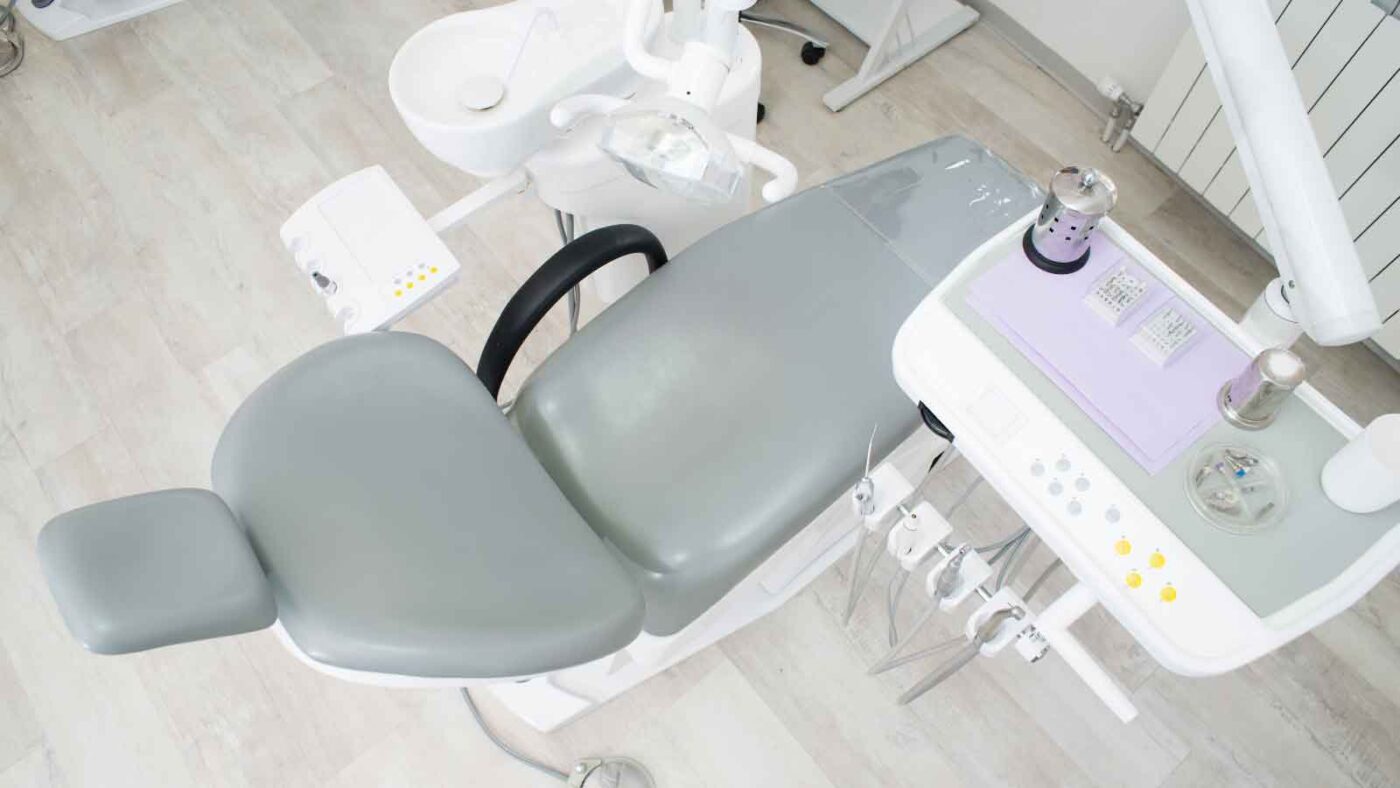 Empty modern dental chair setup.