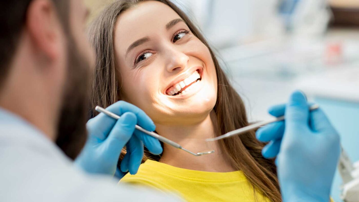 Smiling woman during a dental check-up.