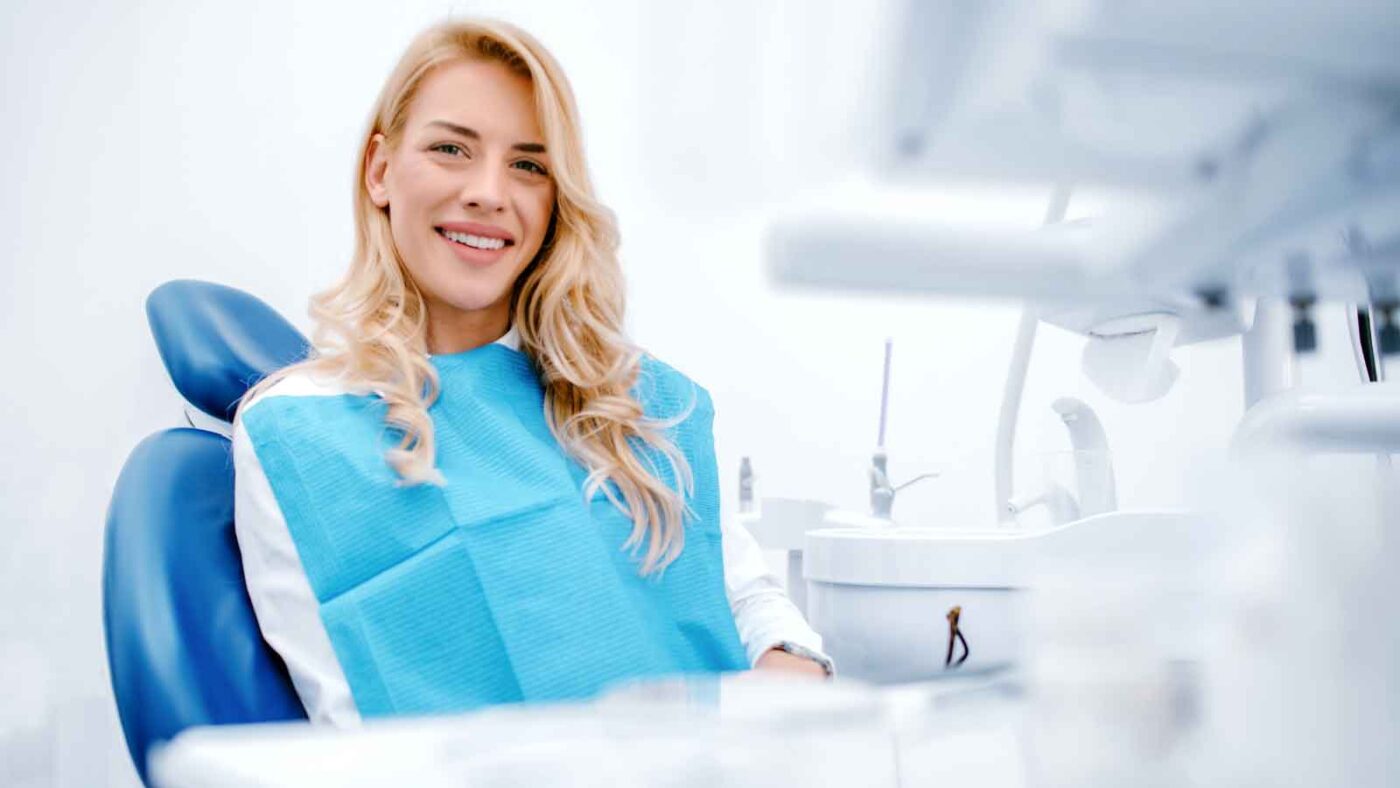 Woman smiling in dental chair.