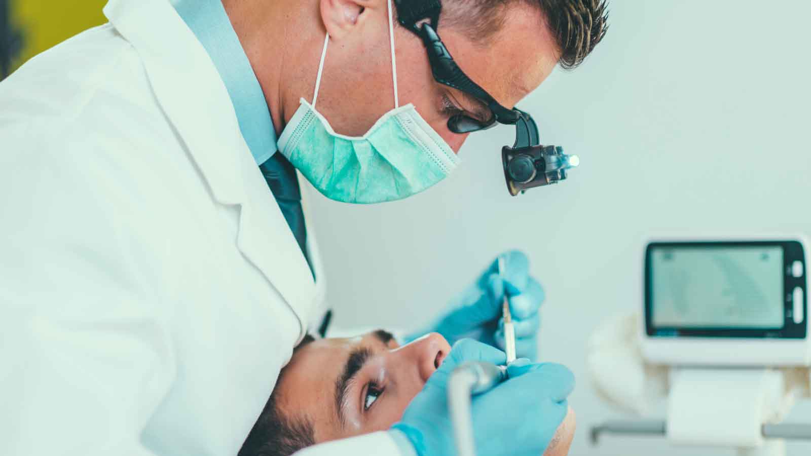 A-dentist-performing-a-root-canal-procedure-on-a-patient